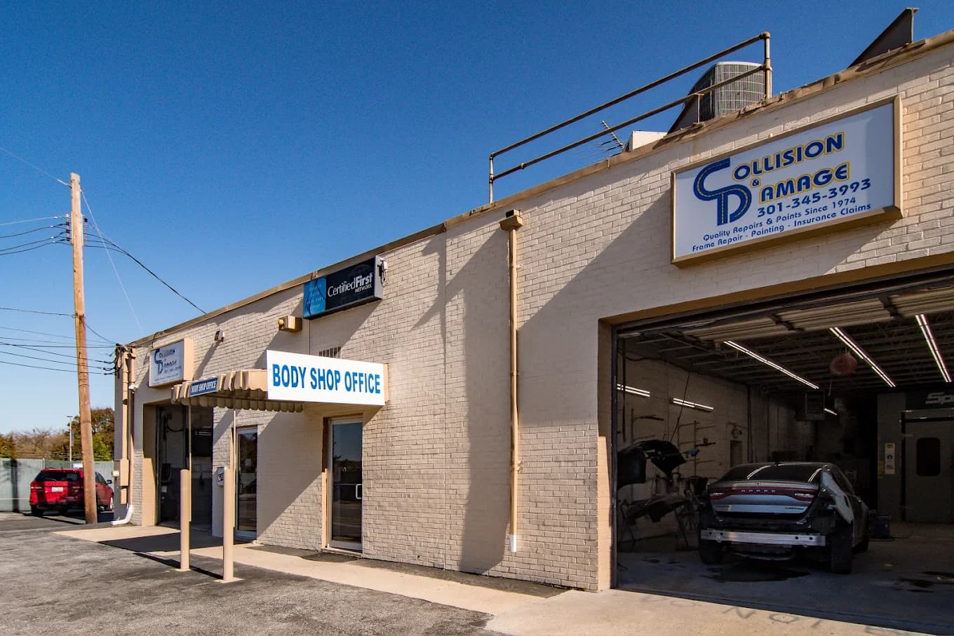 C&D Auto Body certified technicians in action